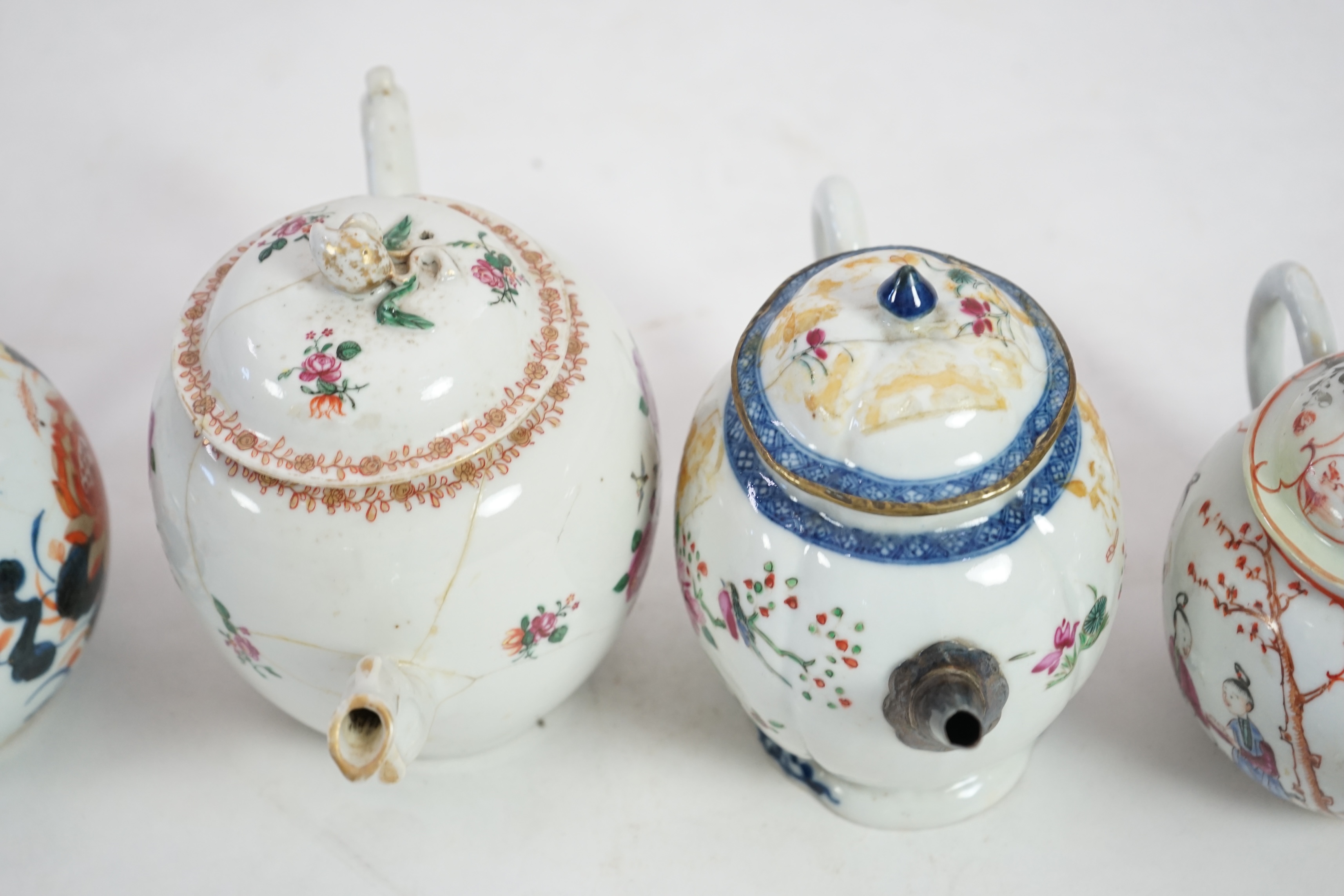 Four 18th century Chinese export polychrome decorated teapots and covers